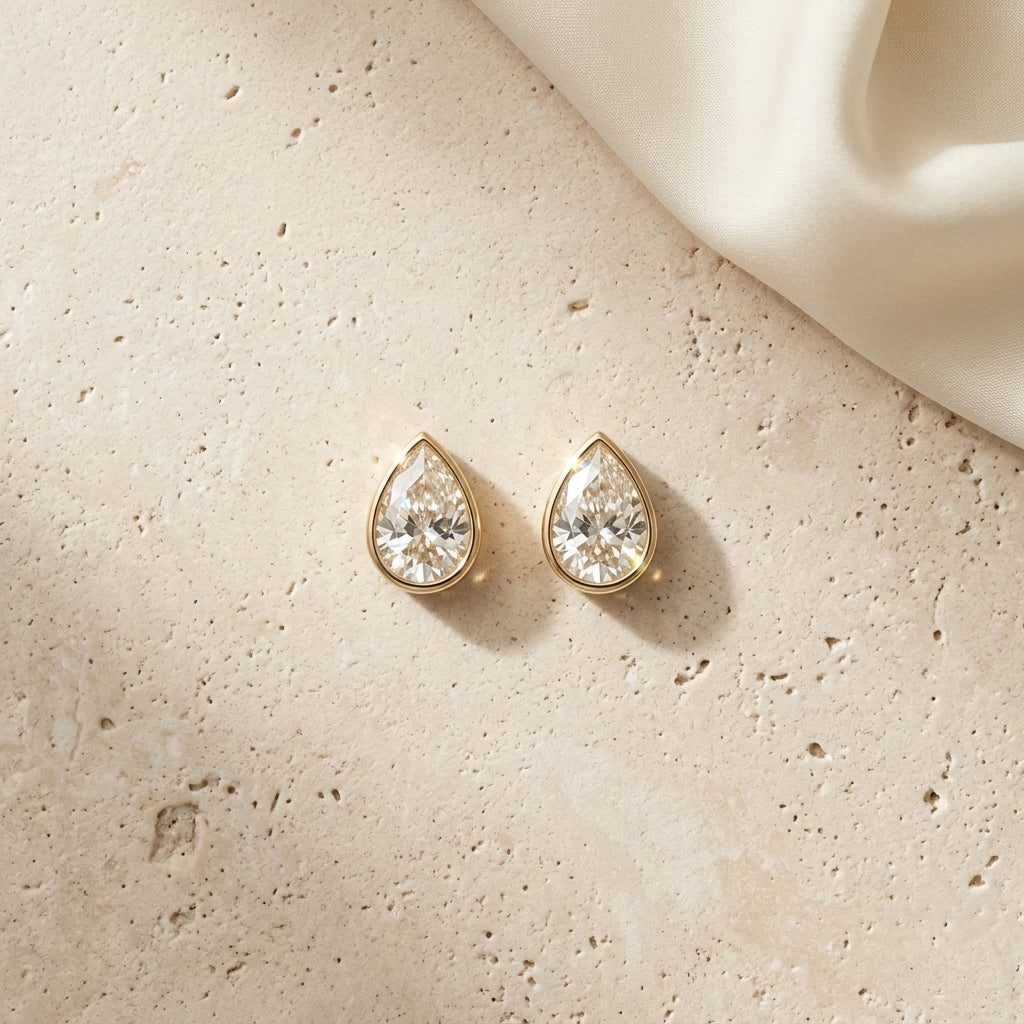 The Bezel Pear Solitaires